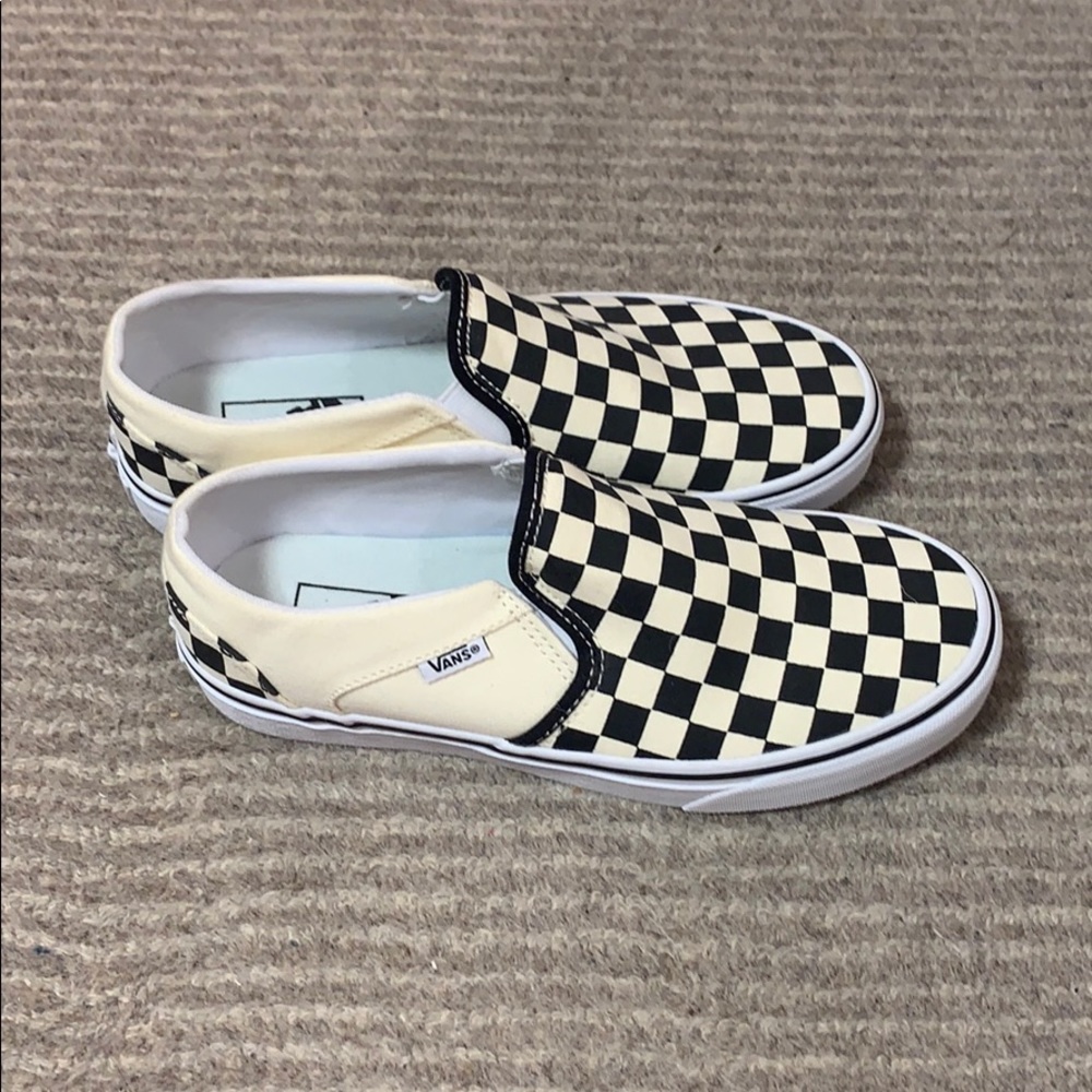 checkered slip on back and white vans